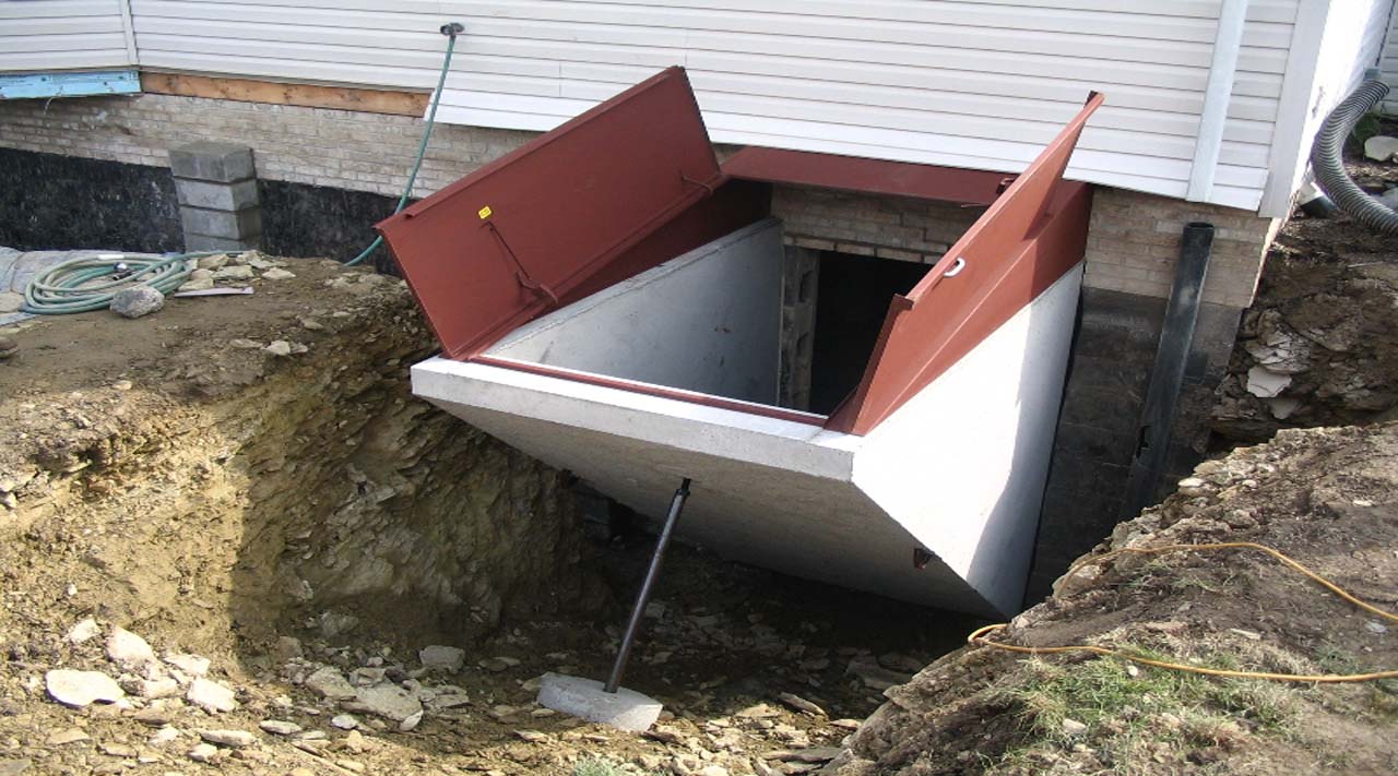 Expertly Crafted Basement Entrance being lowered by crane into place